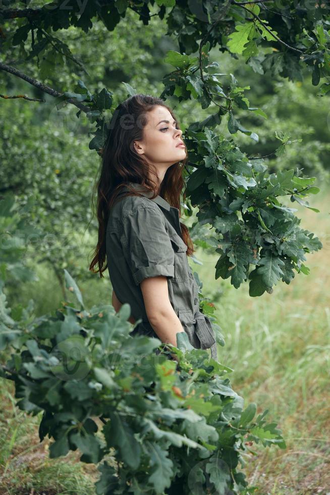 woman in the forest Fresh air travel against the backdrop of the forest photo