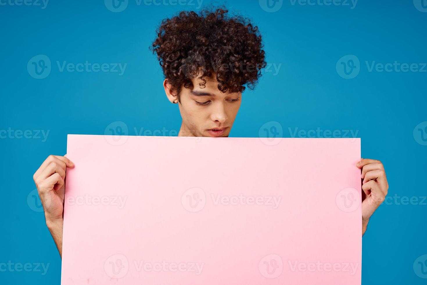 guy with curly hair pink poster Copy Space advertising photo