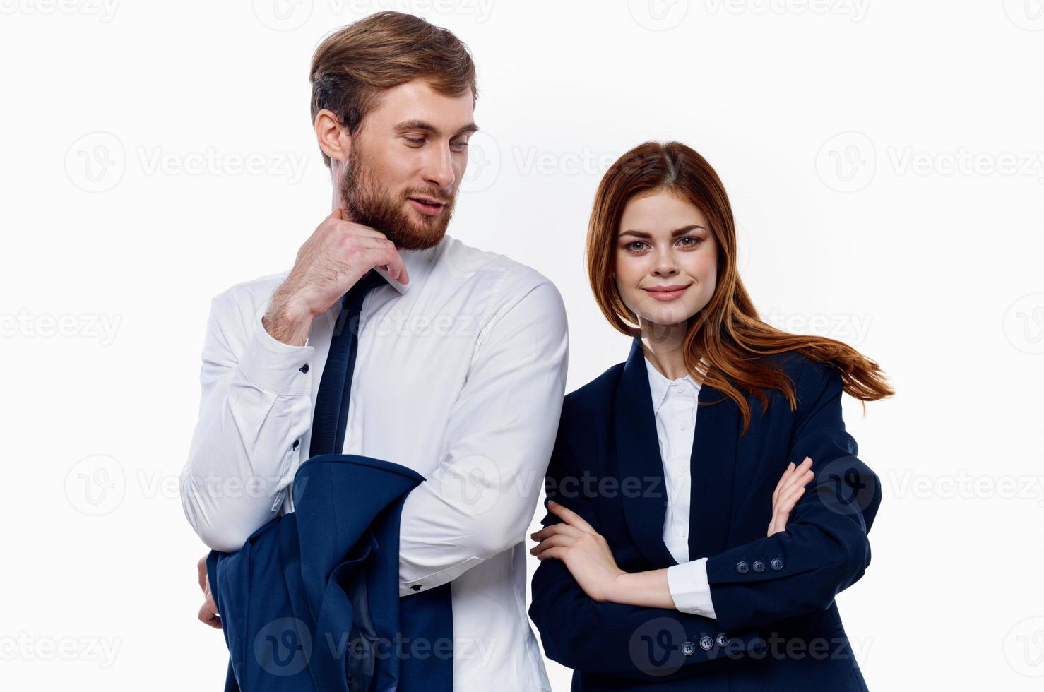 man and woman standing side by side cropped view light background photo