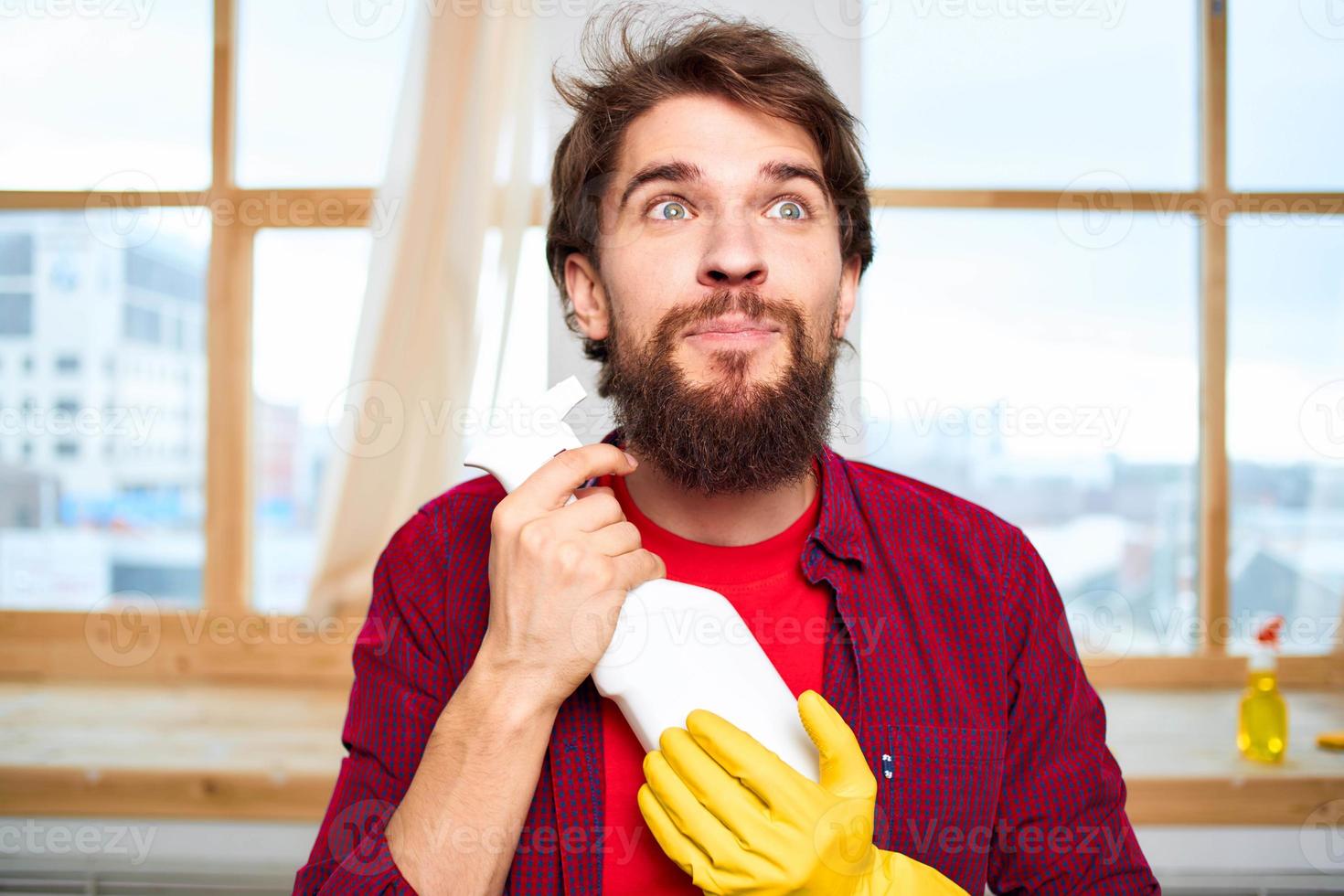 Professional janitor detergent rubber gloves interior window in the background providing lifestyle services photo