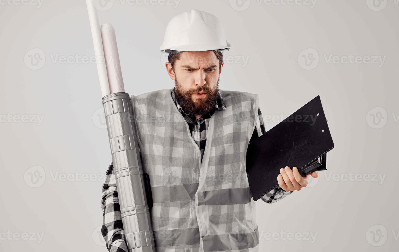 man in working form drawings documents construction photo