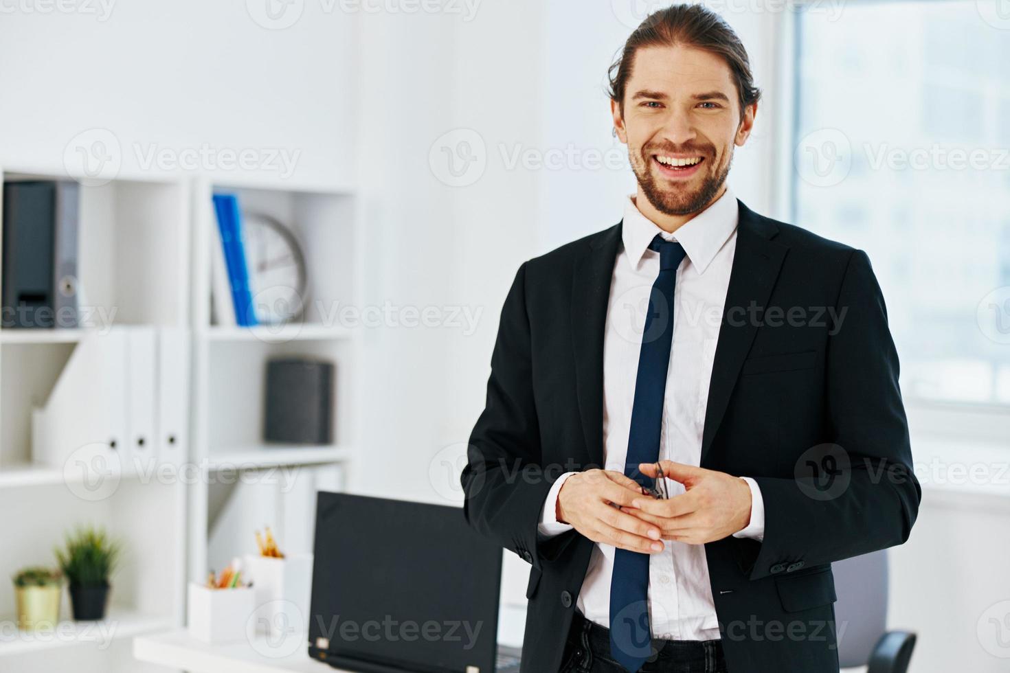 man in a suit in the office with documents executive photo