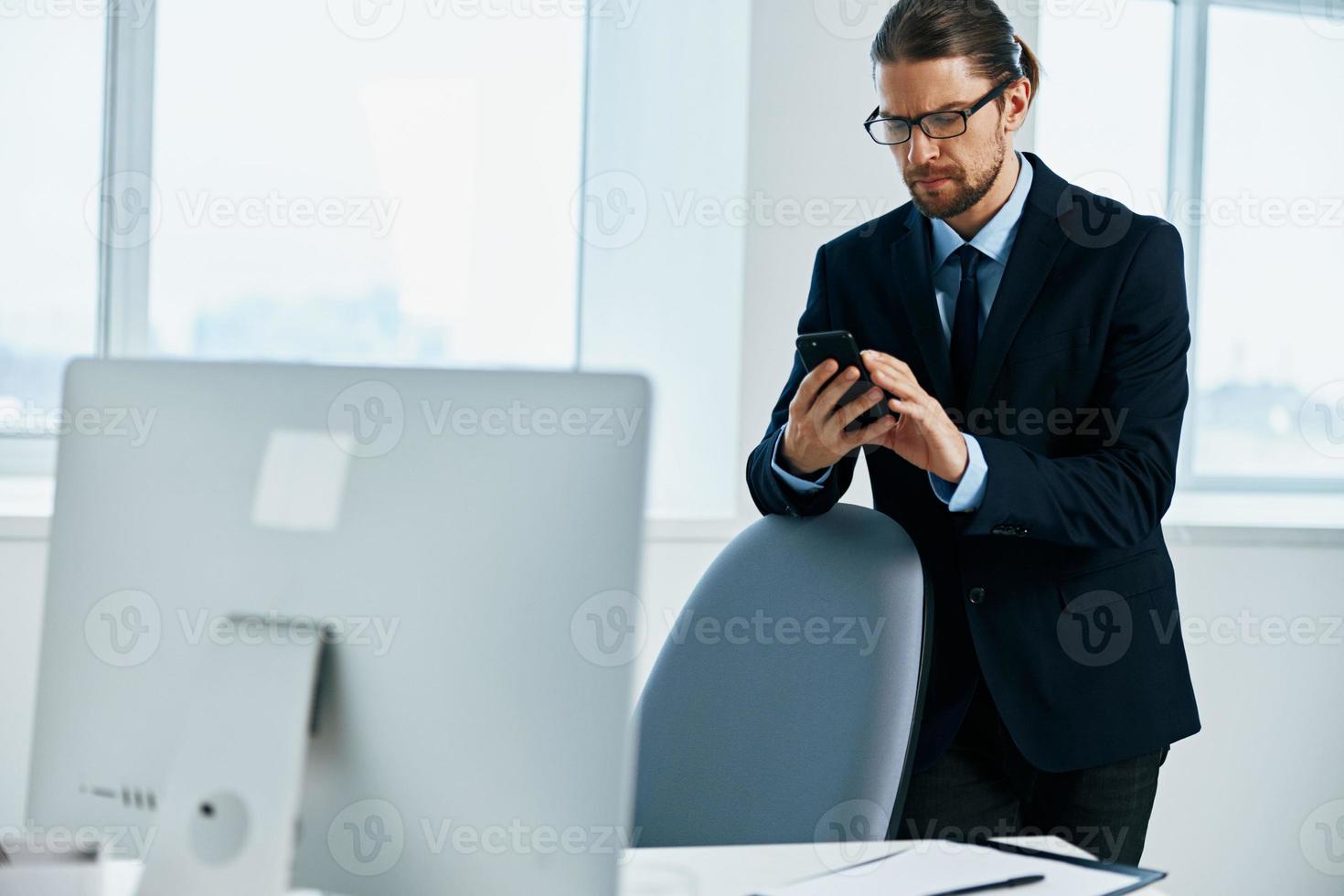 The man in a suit with glasses self-confidence work executive photo