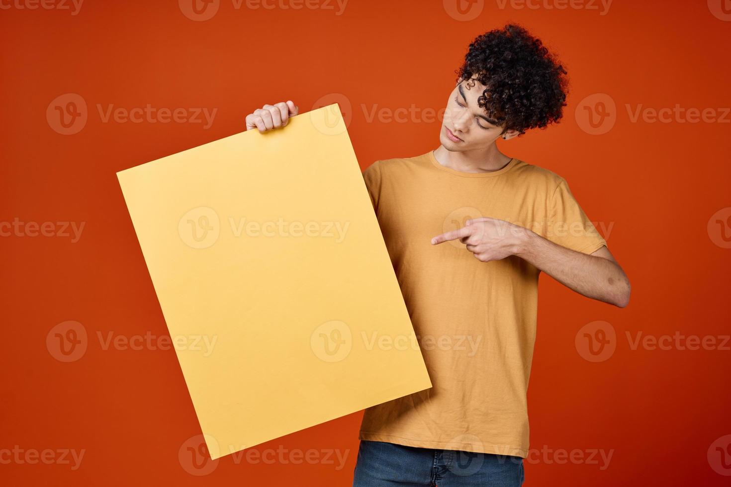 guy with curly hair holding an island in his hands advertising photo