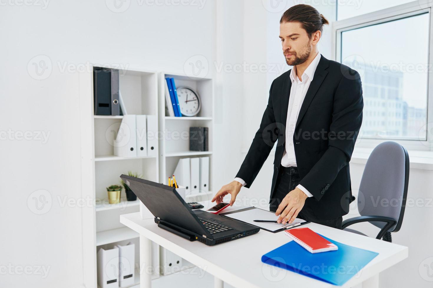 Man at the desk documents technology photo