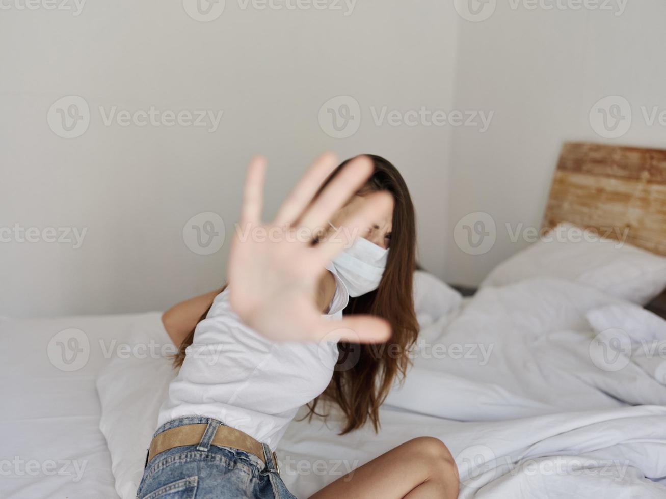 woman wearing medical mask on vacation quarantine pandemic coronavirus photo