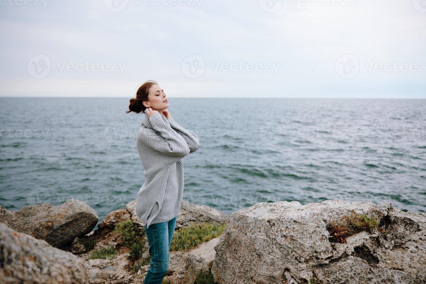 portrait of a woman nature rocks coast landscape Ocean Lifestyle photo