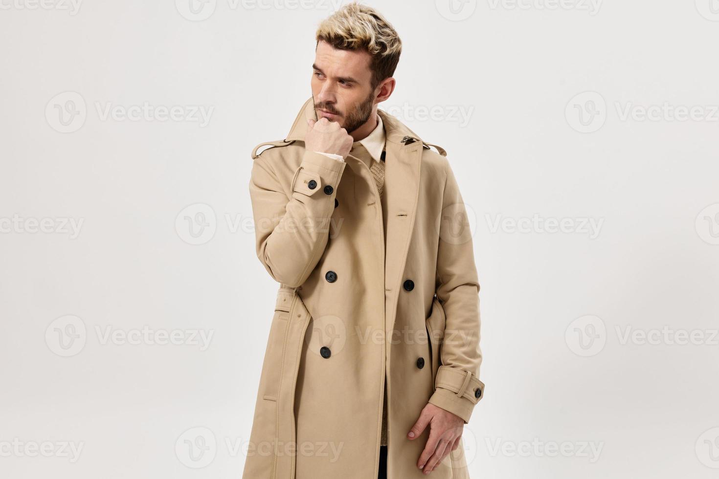 man in beige coat autumn style studio cropped view photo