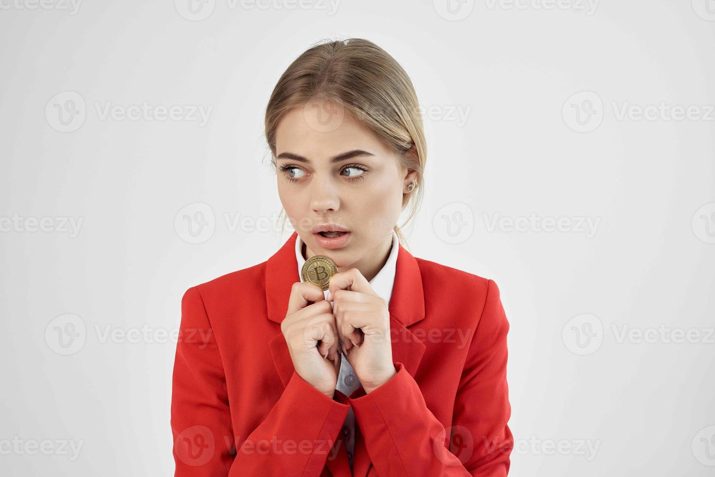 financier in a red jacket gold coin Bitcoin isolated background photo