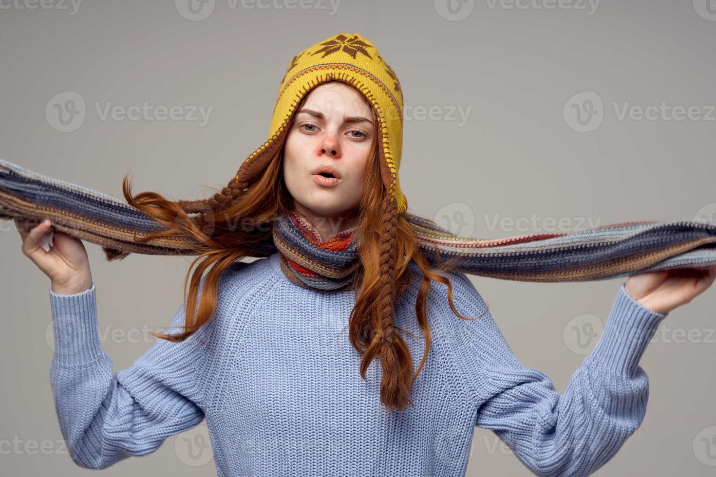 sick woman neck scarf with a hat on his head light background photo