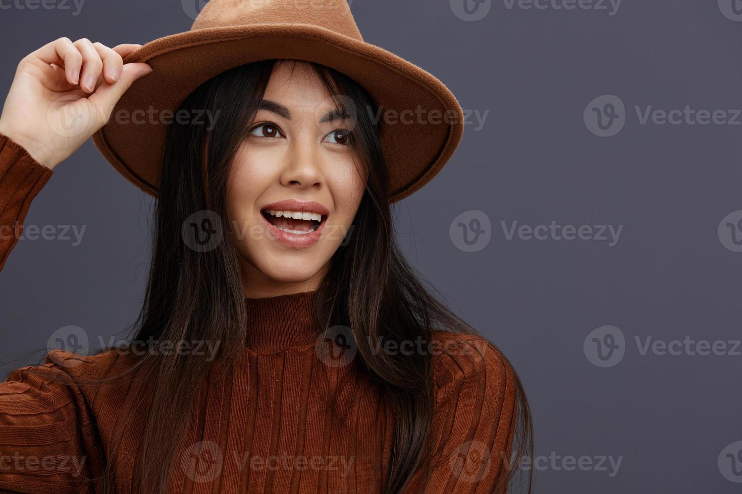 woman brown sweater glamor posing smile fashion Gray background photo