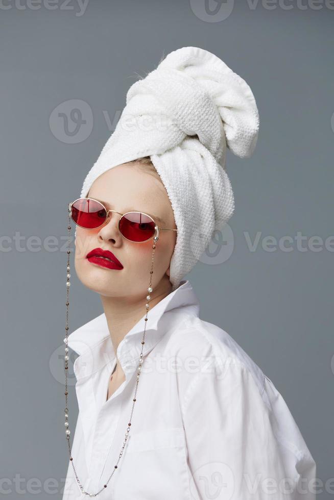 portrait of a woman red sunglasses cosmetics with towel on head Lifestyle posing photo