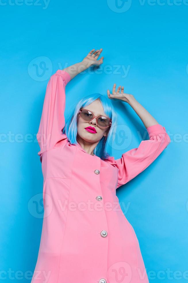 portrait of a woman in sunglasses wears a blue wig makeup isolated background photo