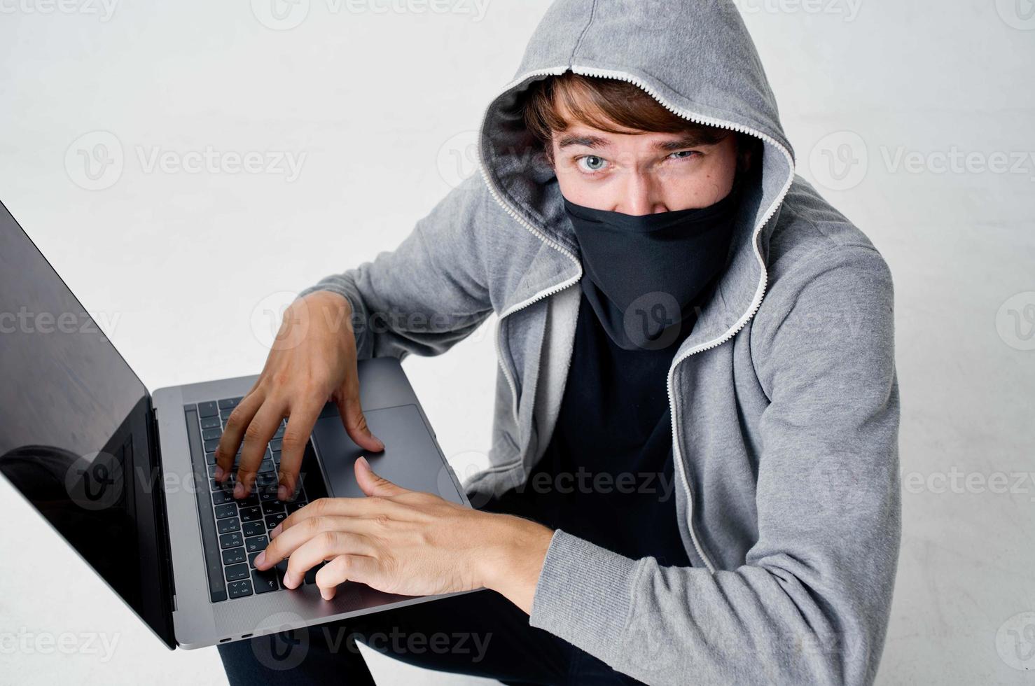 hacker stealth technique robbery safety hooligan light background photo