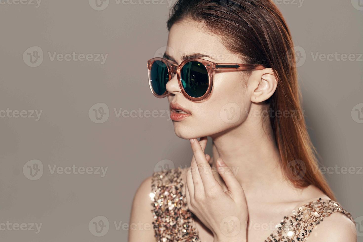 attractive woman wearing sunglasses golden dress decoration model studio photo