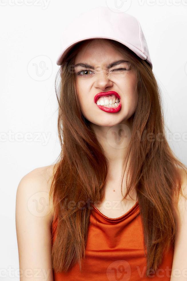 Portrait of a woman in a cap Cheeky look grimace model attractive photo