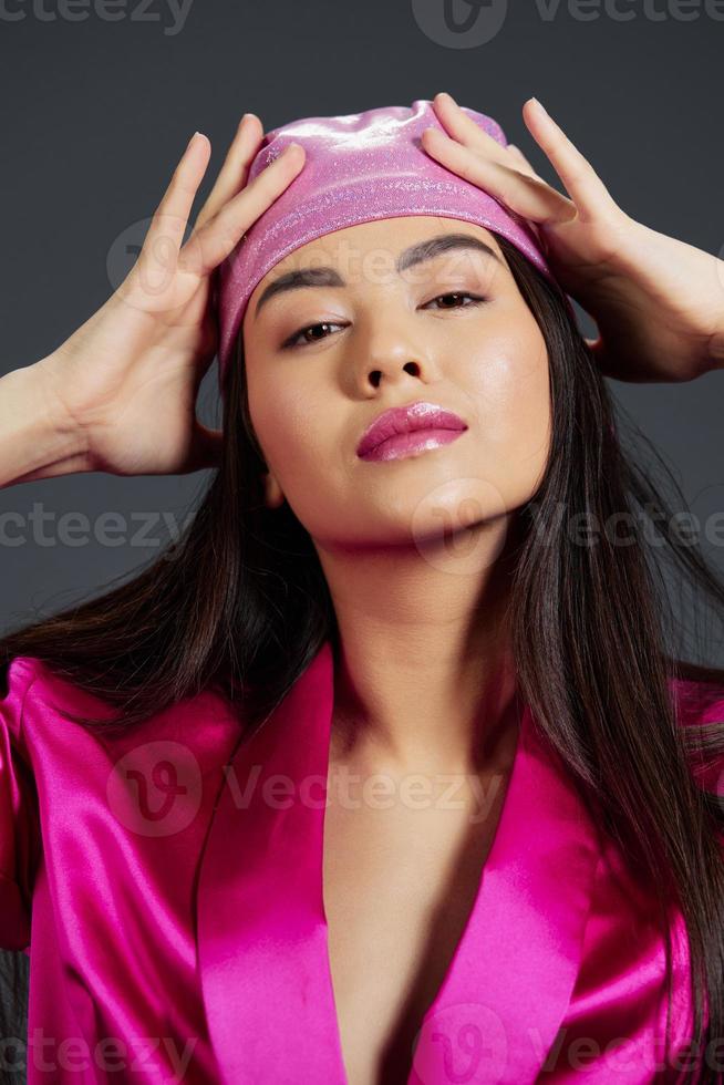 woman posing pink mini dress charm headscarf Gray background photo