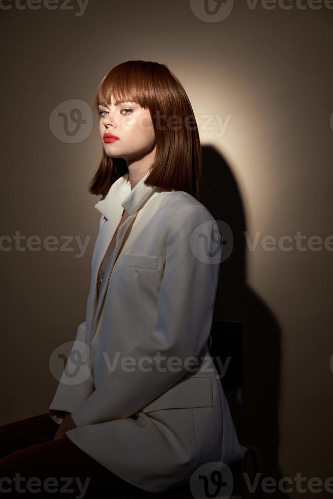 brunette in fashion clothes look at the camera isolated background photo