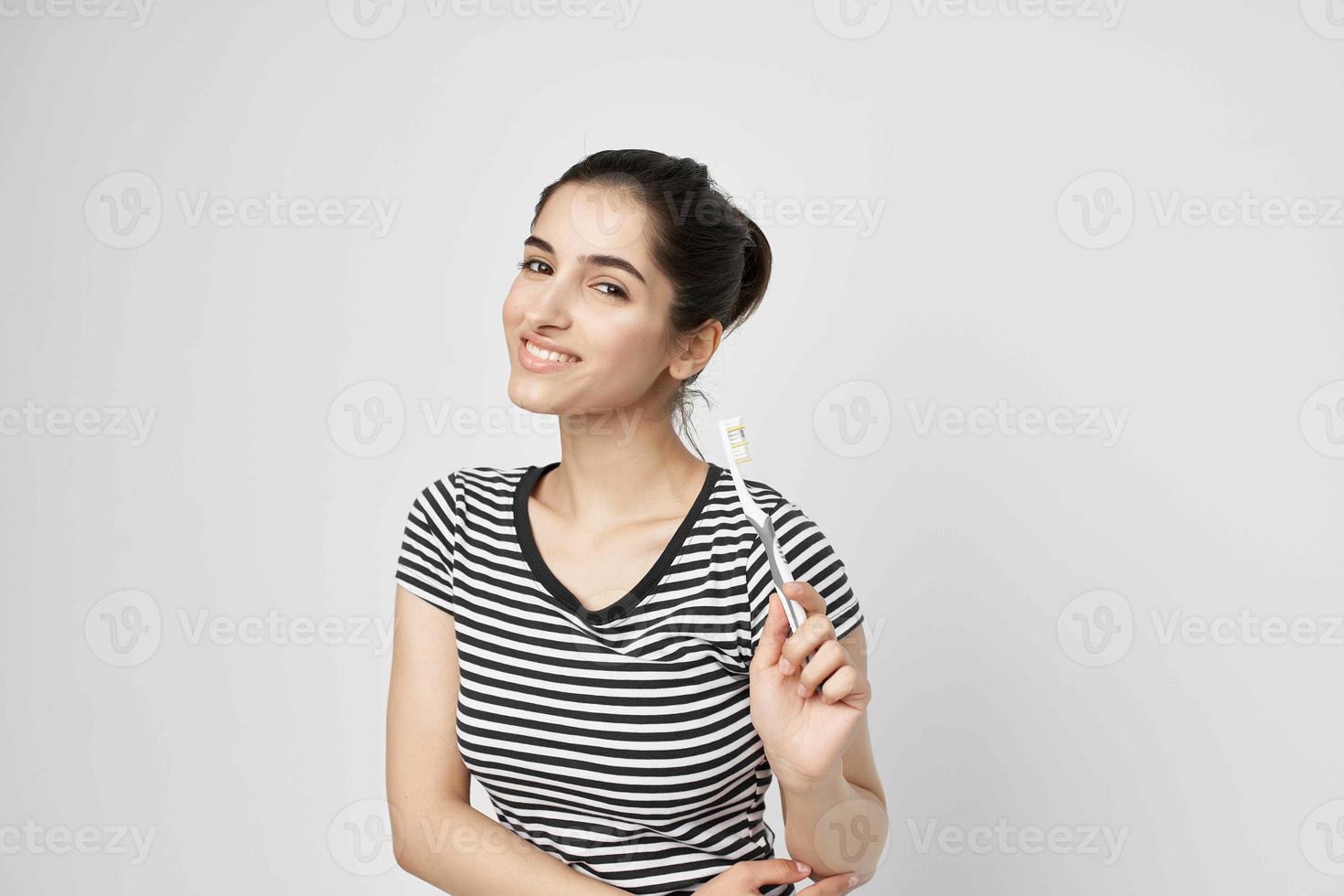 cheerful woman hygiene teeth cleaning care health light background photo