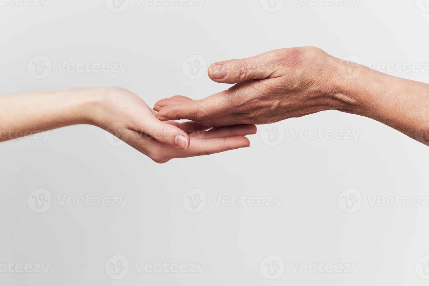 two hands close-up holding each other family help photo