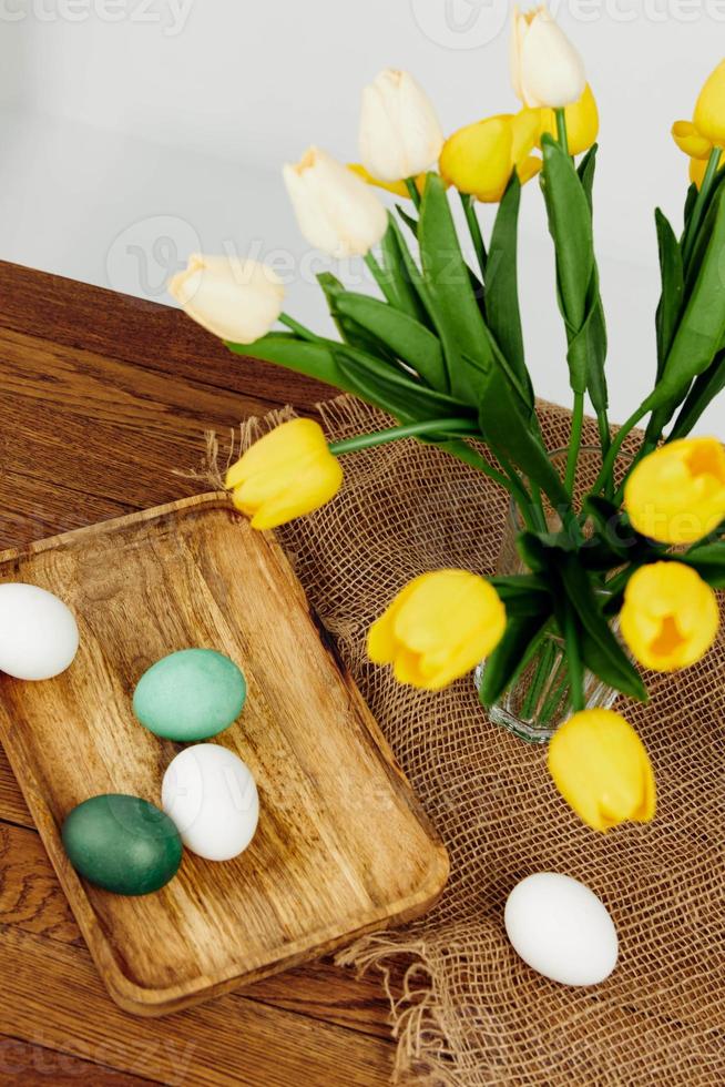 easter eggs multicolored bouquet of flowers spring holiday of christ photo
