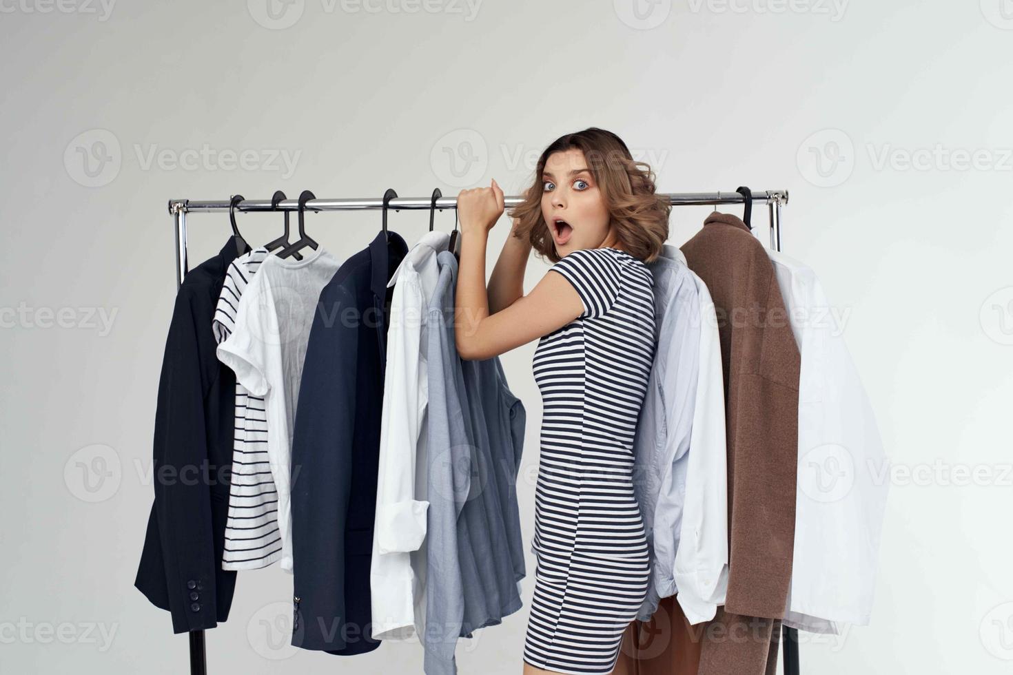 beautiful woman trying on clothes shop retail isolated background photo