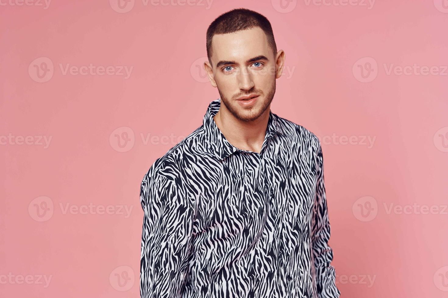 fashionable man shirt posing self confidence pink background photo