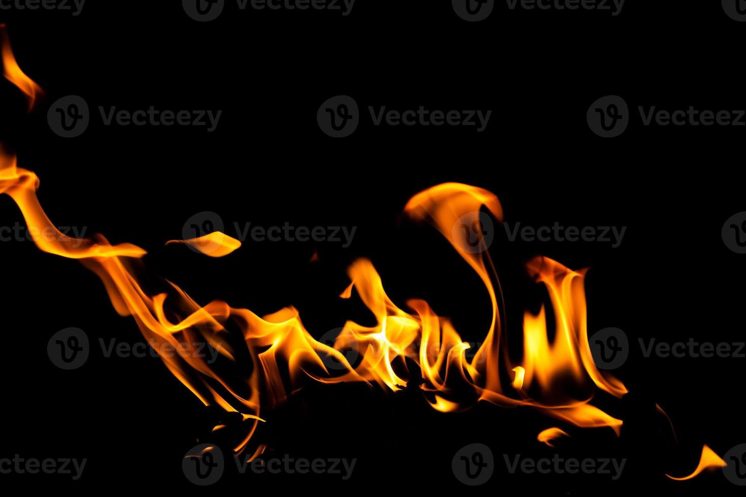 Fire flame texture. Burning material backdrop. Burn effect pattern. Blaze and torch wallpaper. Heat and haze backdrop. photo