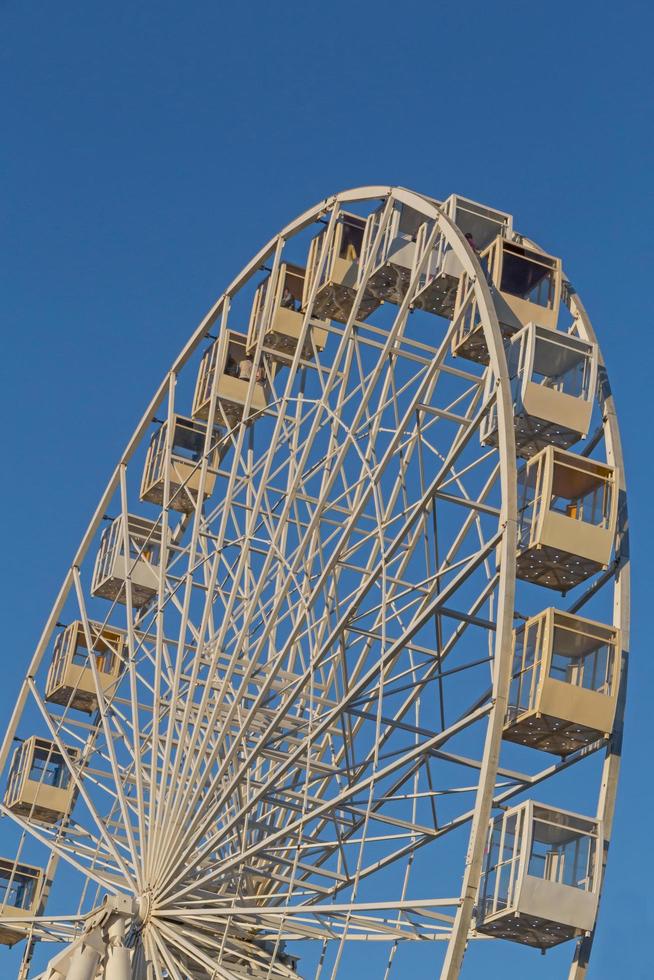 ferris wheel in Kyiv against blue sky photo