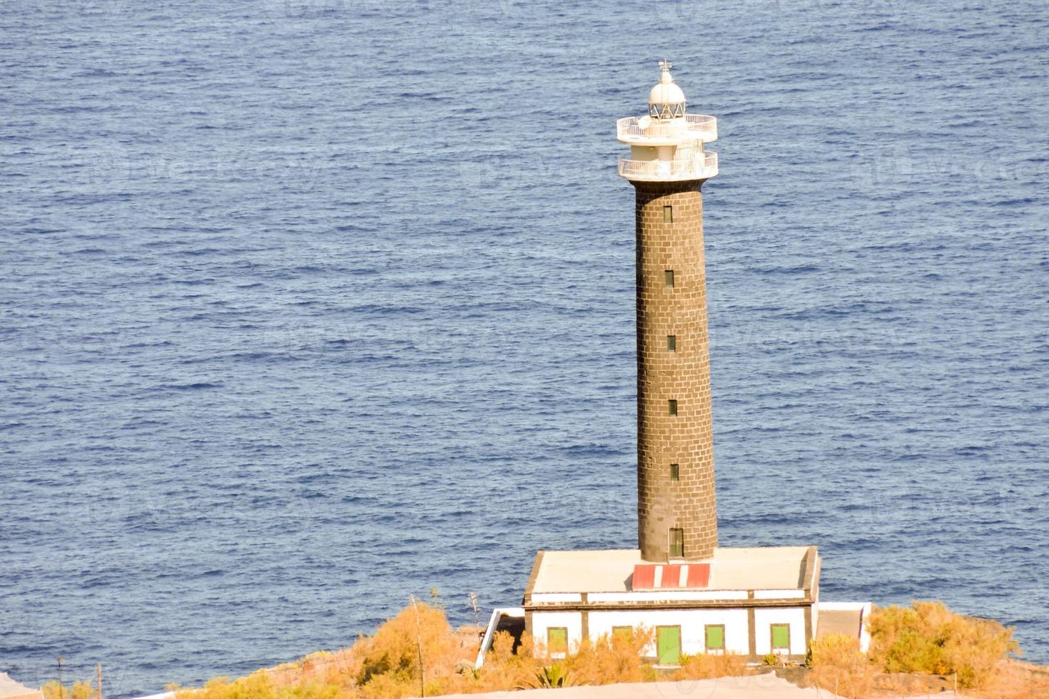 Lighthouse by the sea photo