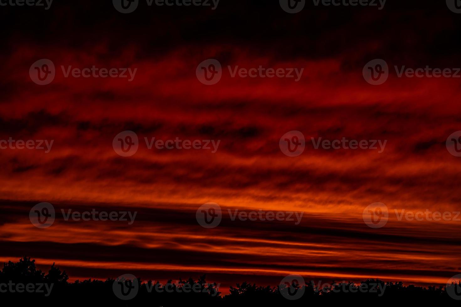 landscape with red sky clouds after sunset photo