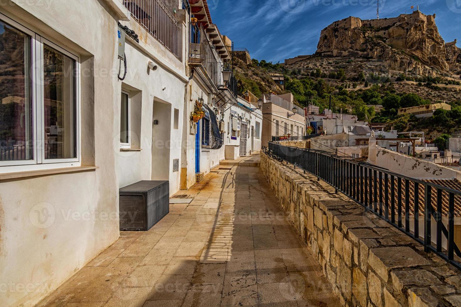 historic old colorful houses Barrio Santa Cruz Alicante Spain on a sunny day photo