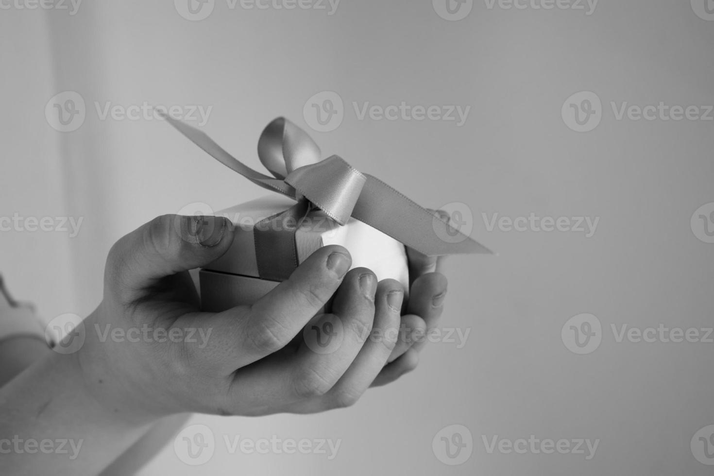 a gift in a white box with a pink bow photo