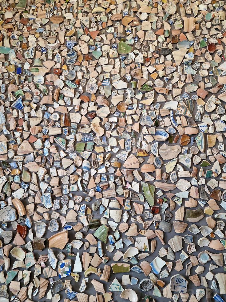 background from pieces of clay colored broken pottery decoration abstract photo