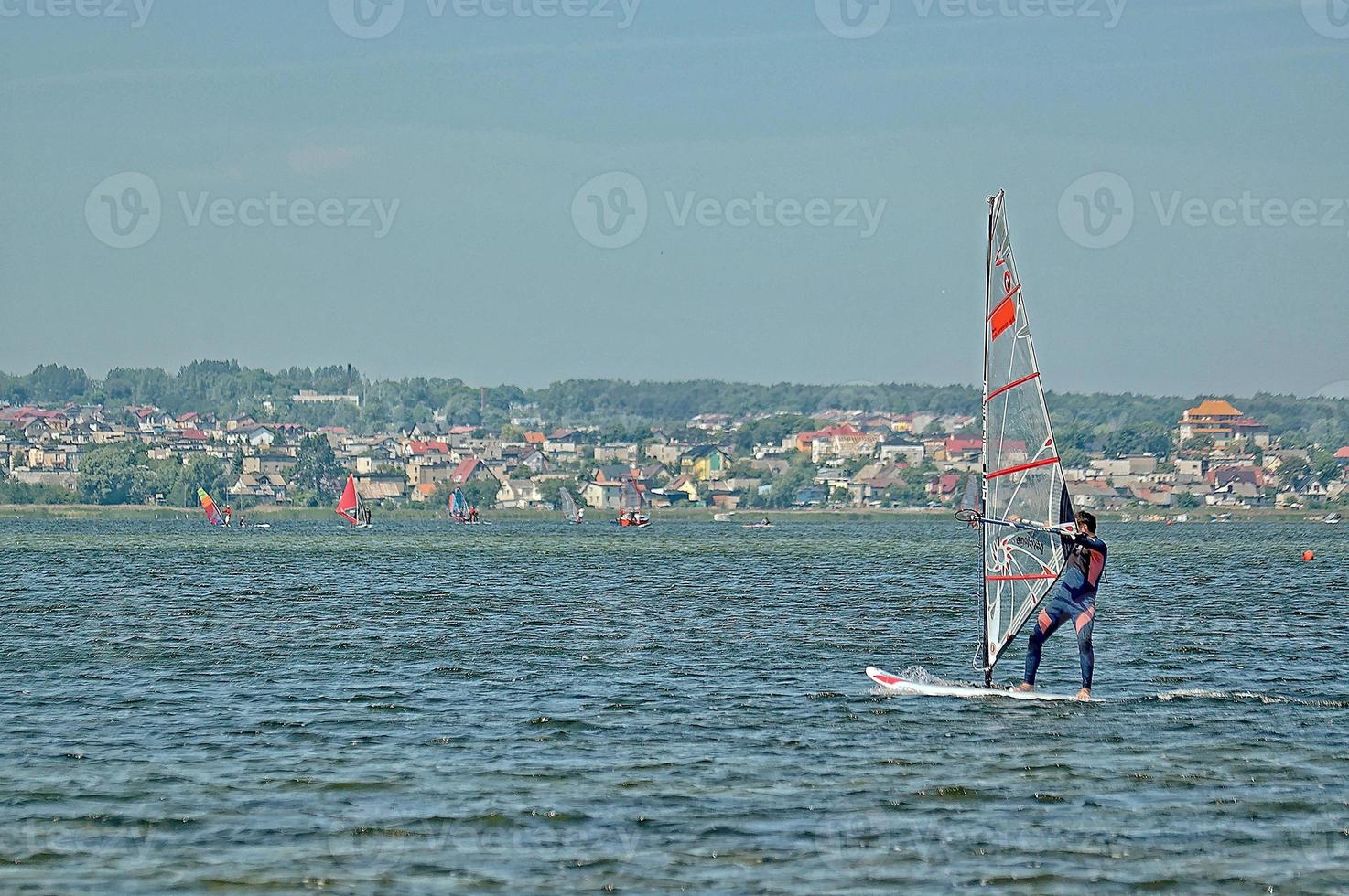 windsurfing on the bay of pucka on the baltic sea photo