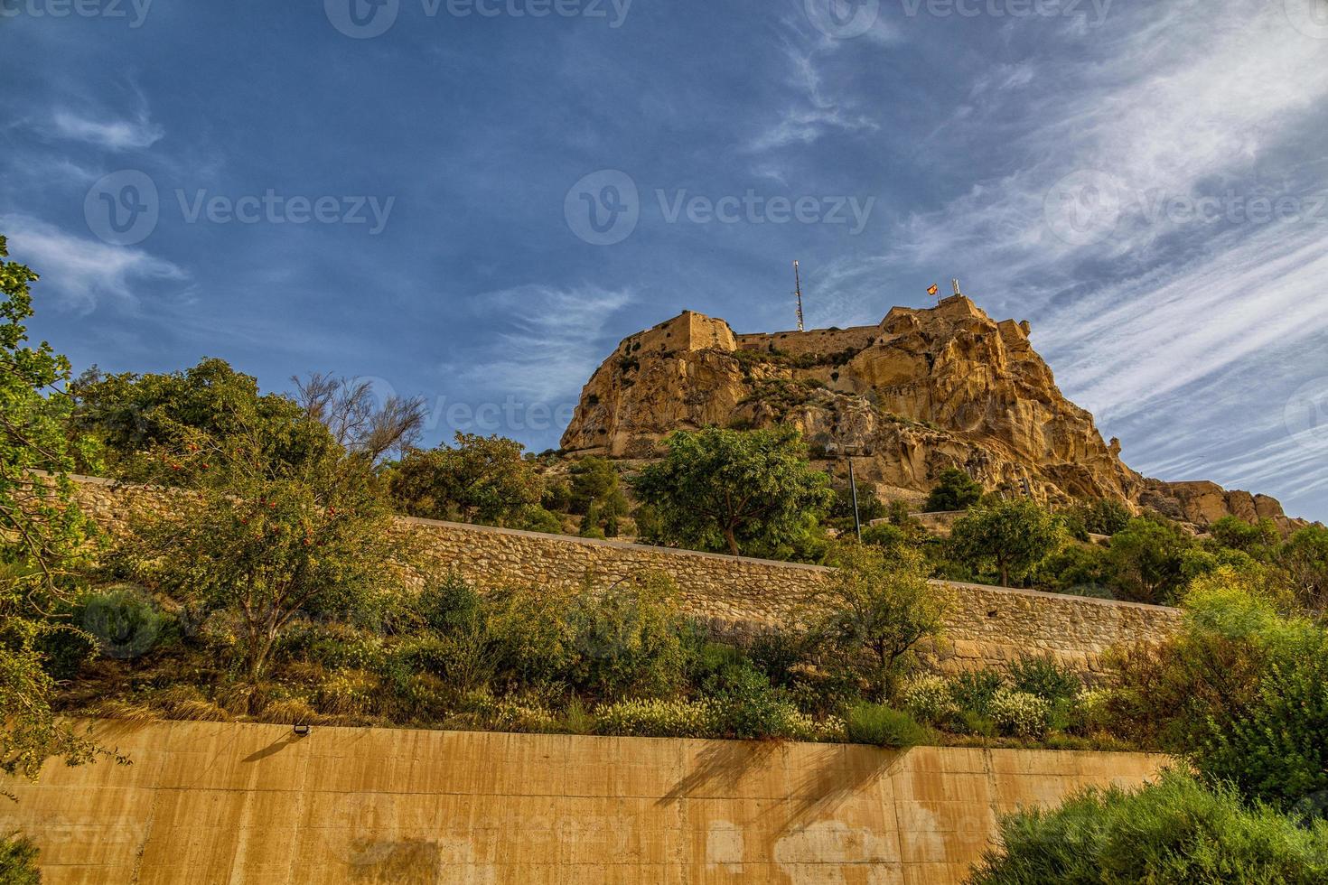 castle of saint barbara in alicante spain against blue sky landmark photo