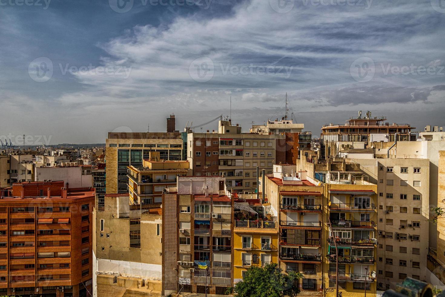 view on a sunny day of the city and colorful buildings from the viewpoint Alicante Spain photo