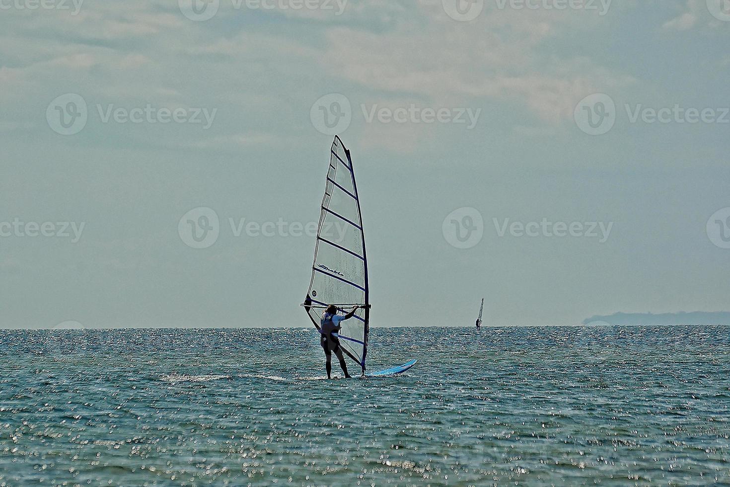 windsurfing on the bay of pucka on the baltic sea photo