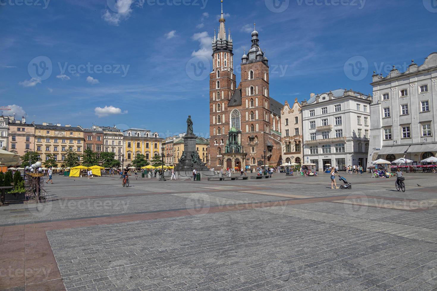 historic church in the old town square in krakow, poland on a summer holiday day photo