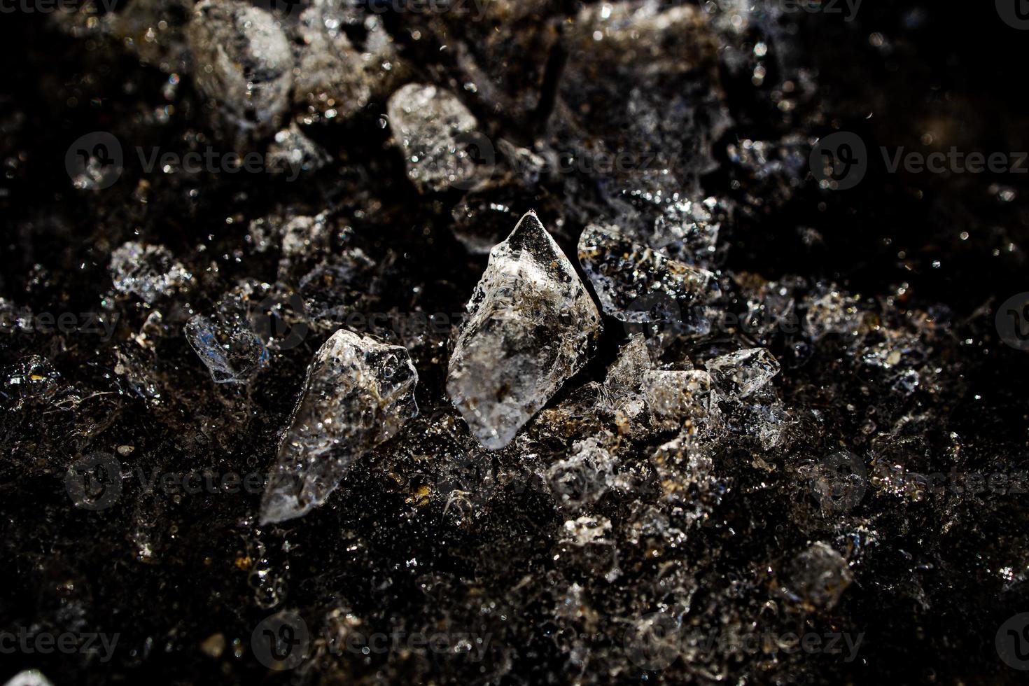 nteresting abstract background with ice close-up on a frozen puddle photo