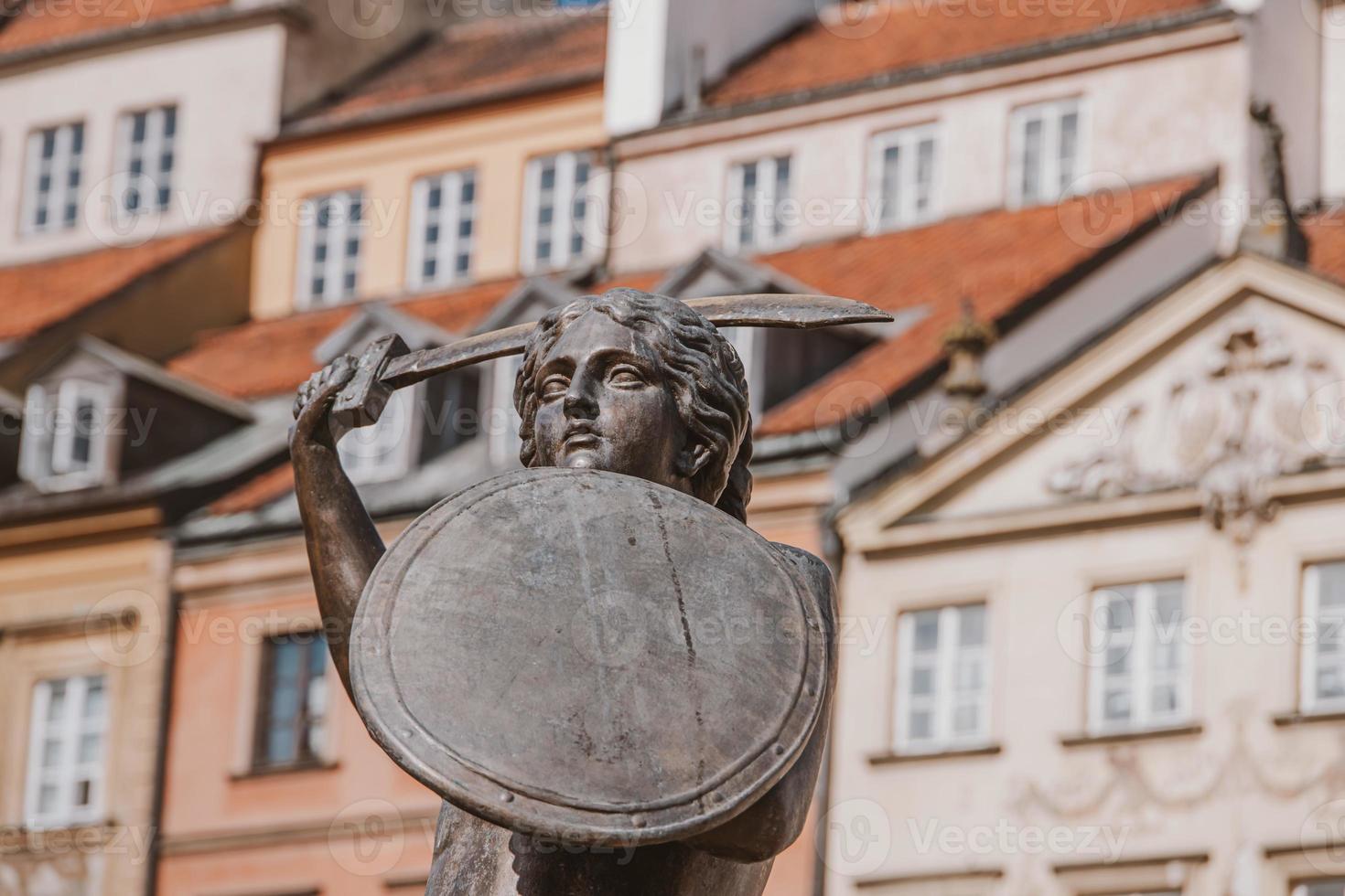 historic mermaid statue in warsaw old town, poland on a summer holiday day photo