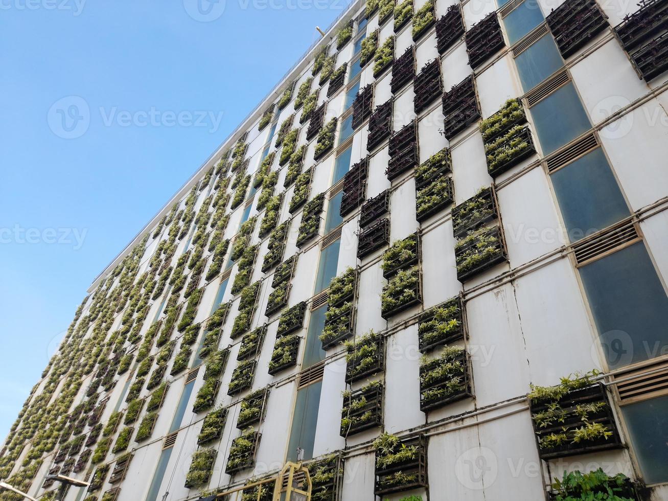 View of the Facade of multi storey parking building, green building, Jakarta, Indonesia - March 20th, 2023 photo