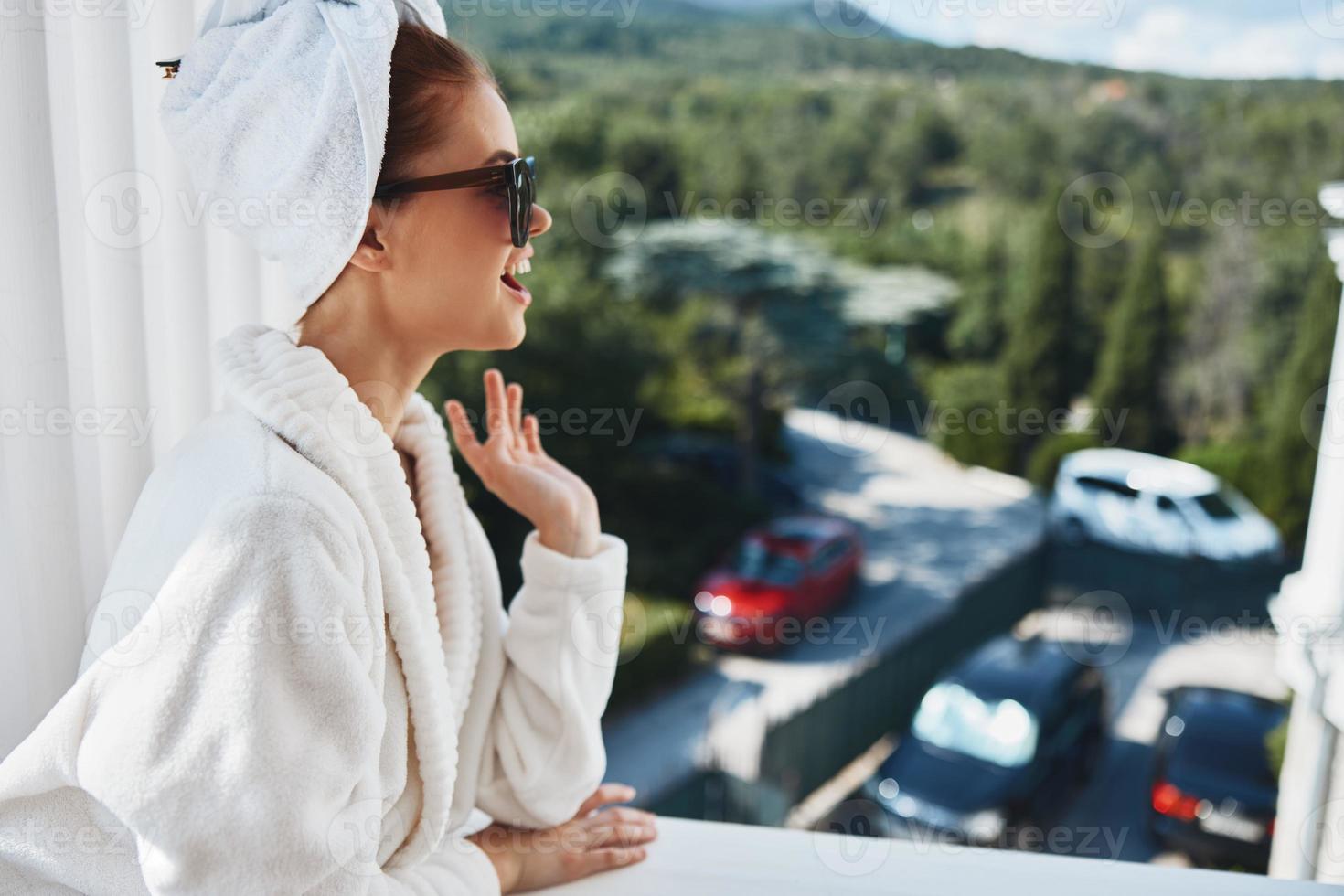 pretty woman posing against the backdrop of mountains on the balcony architecture Perfect sunny morning photo