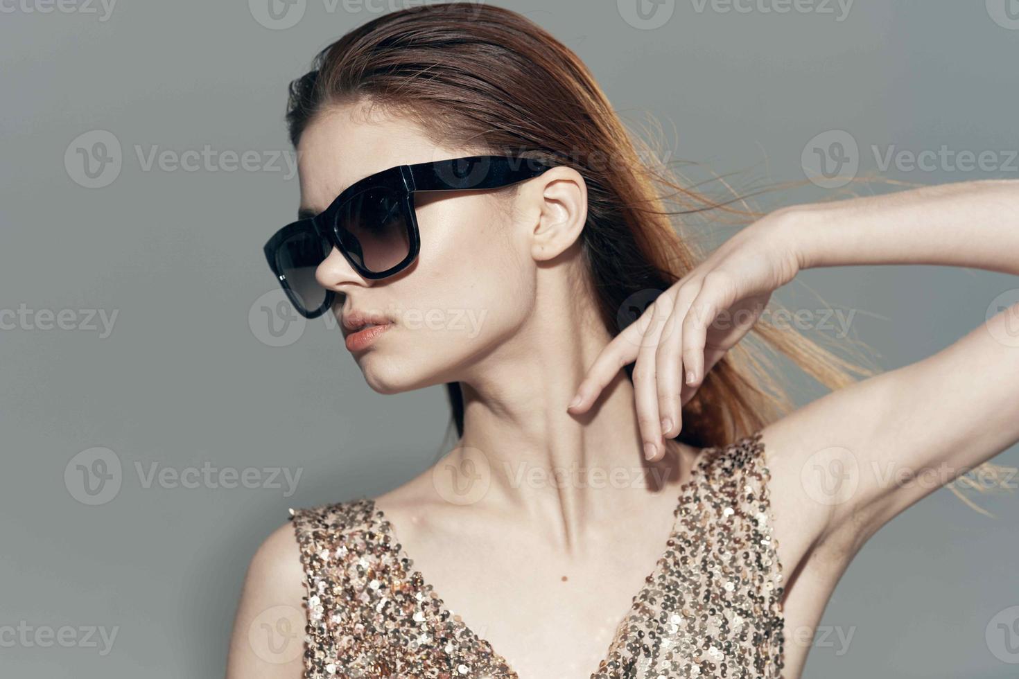 pretty woman wearing sunglasses fashion glamor shiny dress luxury photo