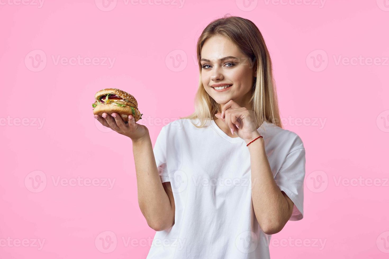 cute blonde in white t-shirt hamburger delicious food restaurant photo