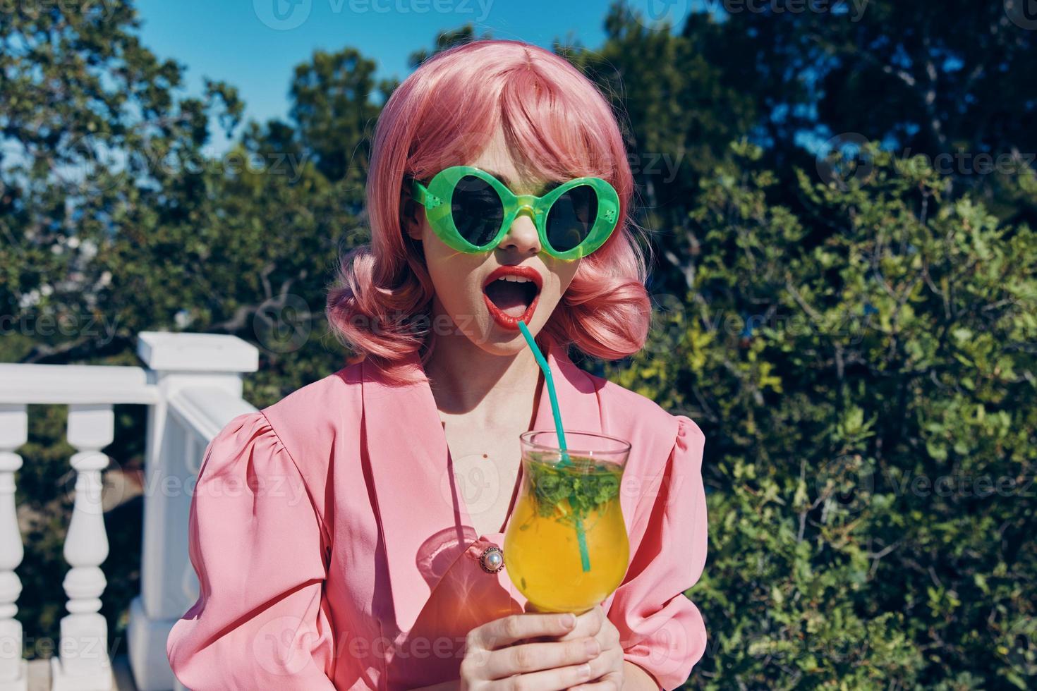 Delighted young girl with pink hair summer cocktail refreshing drink Relaxation concept photo