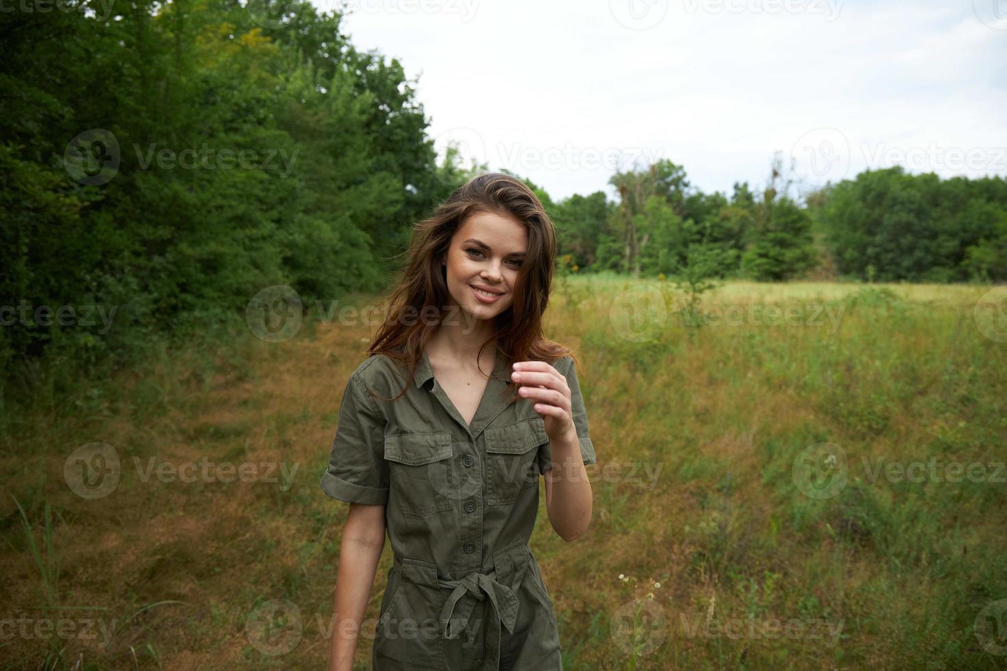 woman outdoors green jumpsuit fun travel lifestyle and fresh air photo