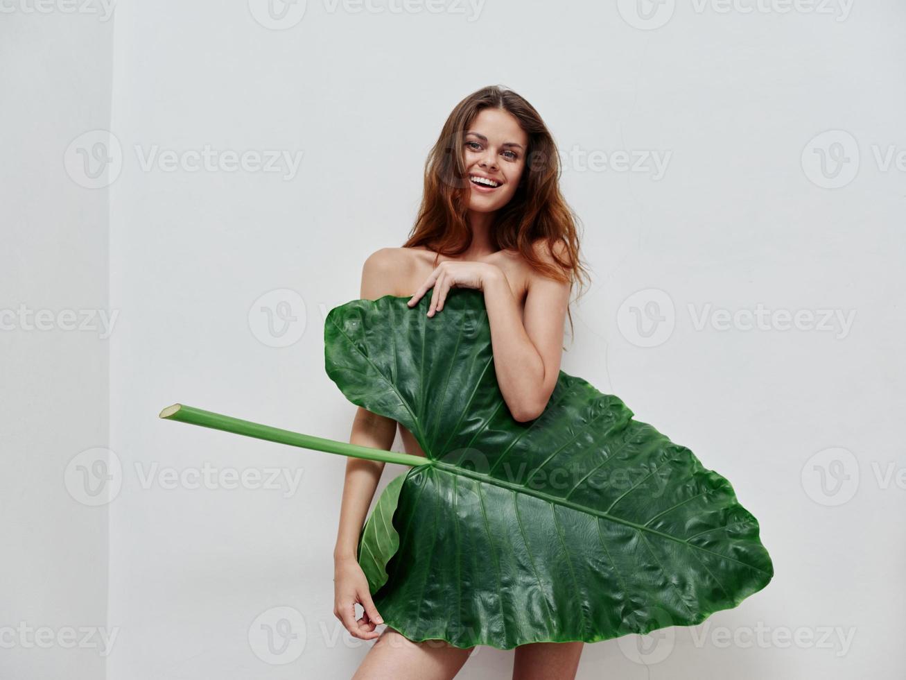 smiling woman palm leaf nude body charm isolated background photo