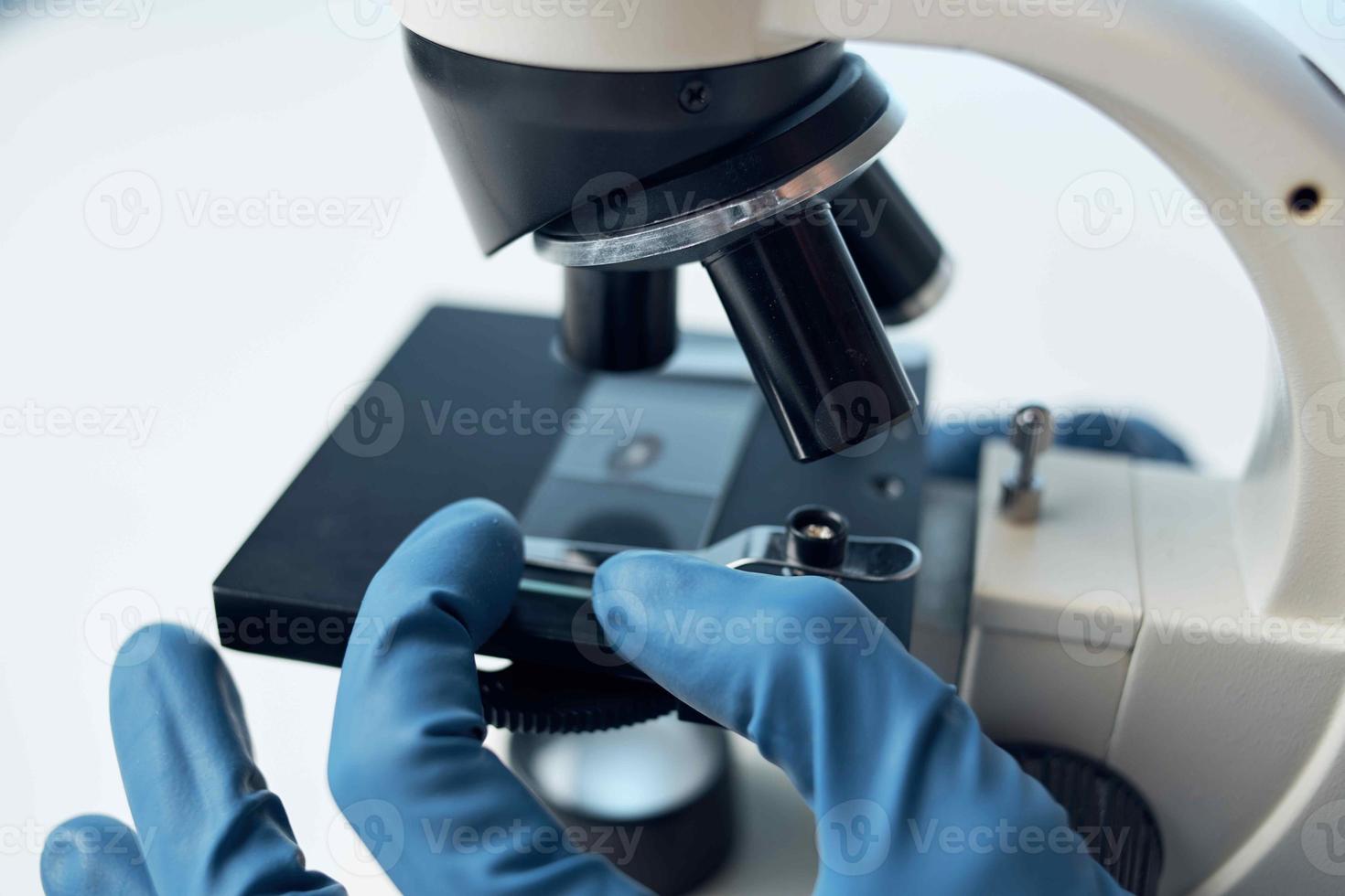 female doctor laboratory science research microscope photo