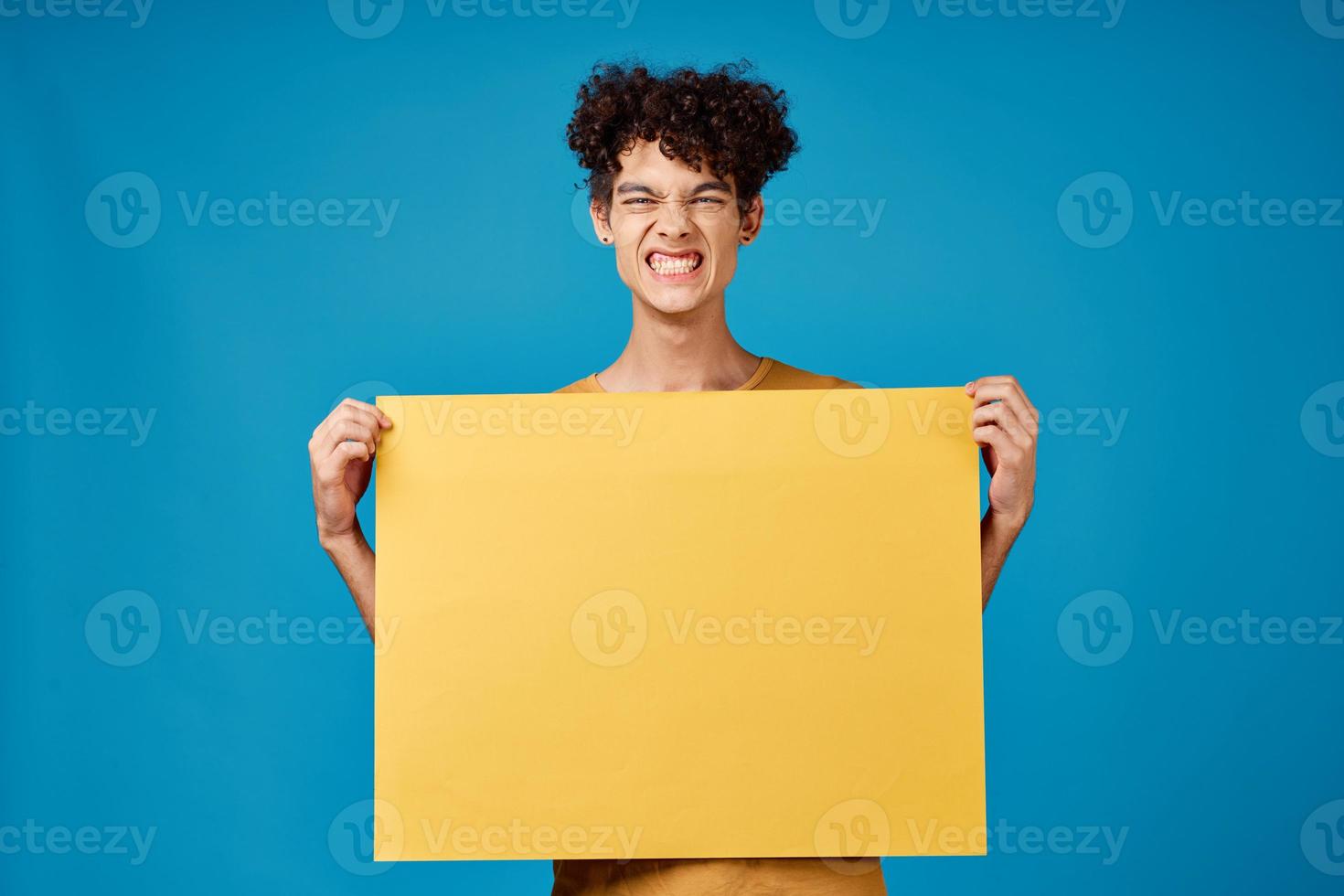 funny curly guys with a yellow sharp advertising Copy Space blue background photo